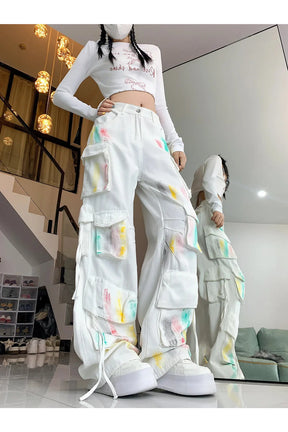 White Pastel Graffiti Cargo Pants: Vibrant design.