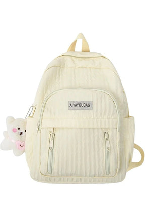 Pastel Pink Teddy Backpack in light yellow hue.