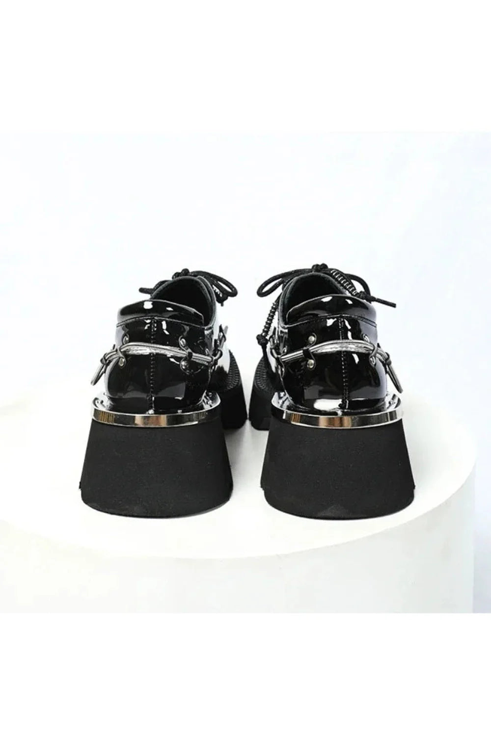 Stylish black patent leather oxford shoes.