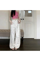 Wide-leg pants with petal motif pattern.