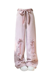 Pink lace-up pants with adorable bow detail.