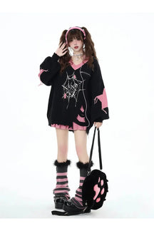 Black variant of Pink Gothic Web Sweater highlights elegance.