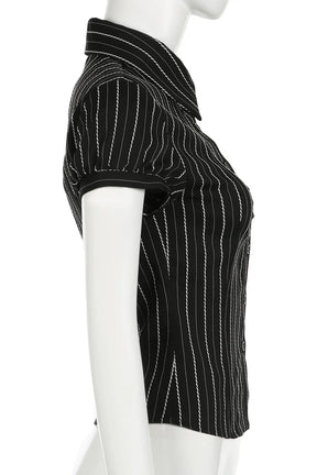 Black pinstripe fitted button-up blouse exudes sophistication.