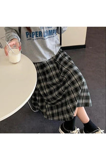 Stylish black plaid midi student skirt.