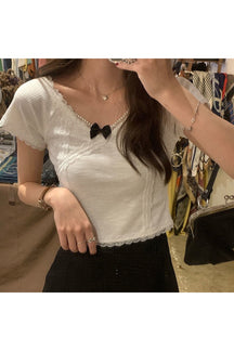 Stylish white lace crop top for preppy look.