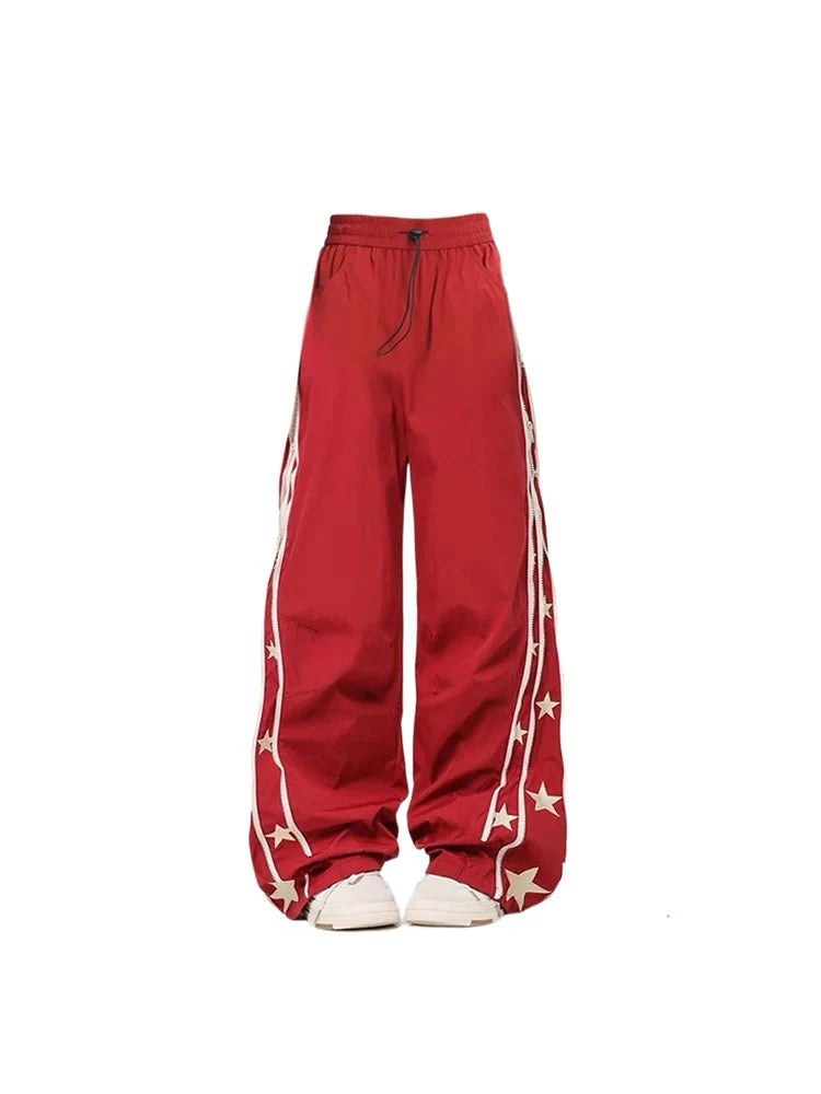 Wine Red track pants with star stripes.