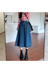 Vintage-inspired blue denim long skirt in retro style.