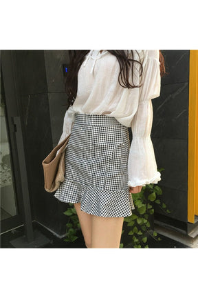 Retro Plaid Mini Skirt in black, classic pattern.