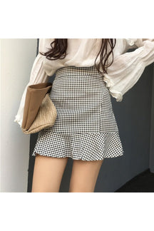 Retro Plaid Mini Skirt in black, classic pattern.