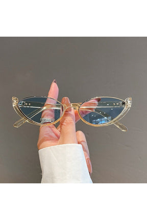 Elegant rimless cat eye sunglasses in champagne-blue.