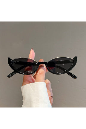 Chic black-black rimless cat eye sunglasses.