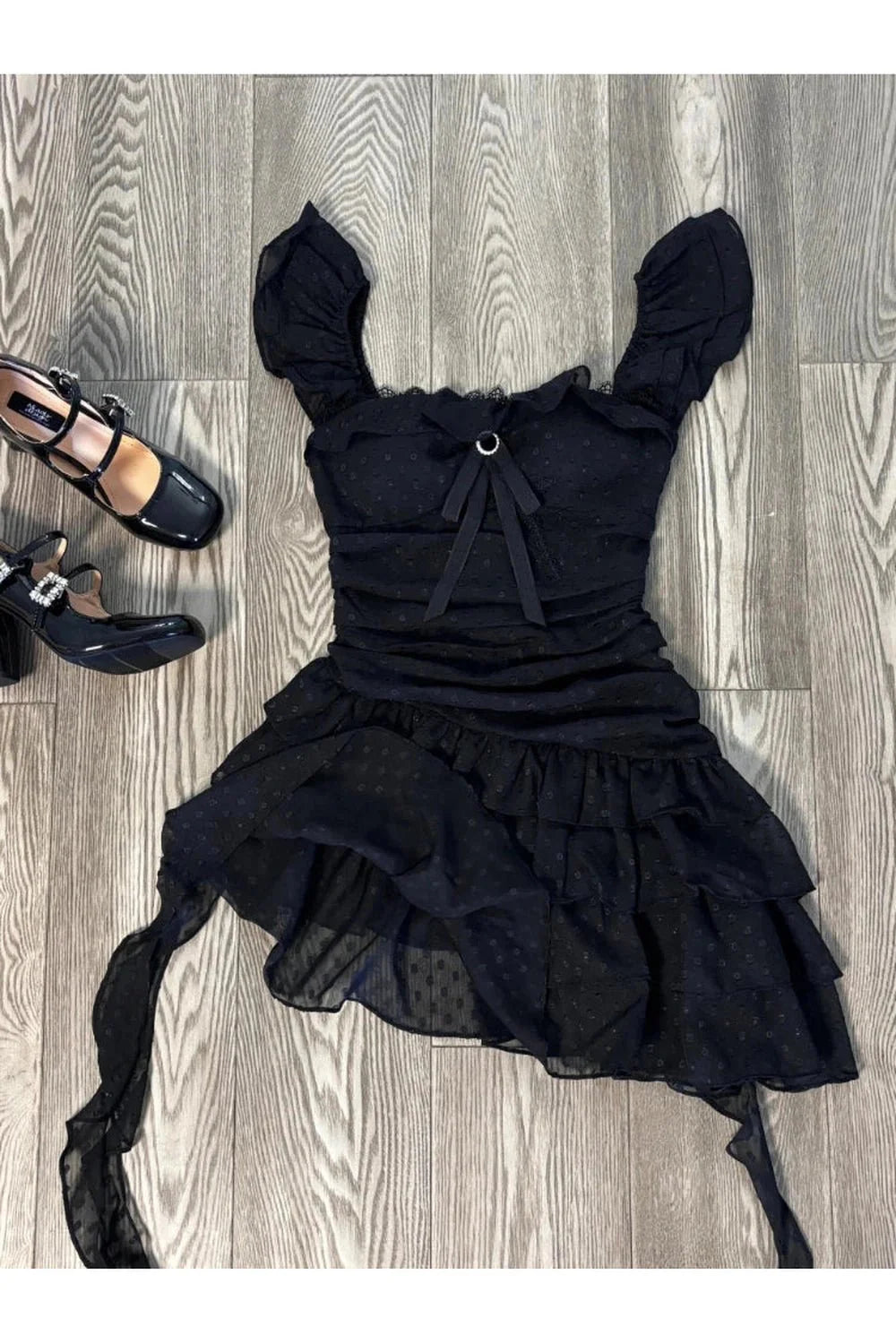 Black Ruffled Dark Fairy Mini Dress exudes elegance.