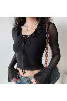 Black ruffled mesh sleeve crop top, chic style.