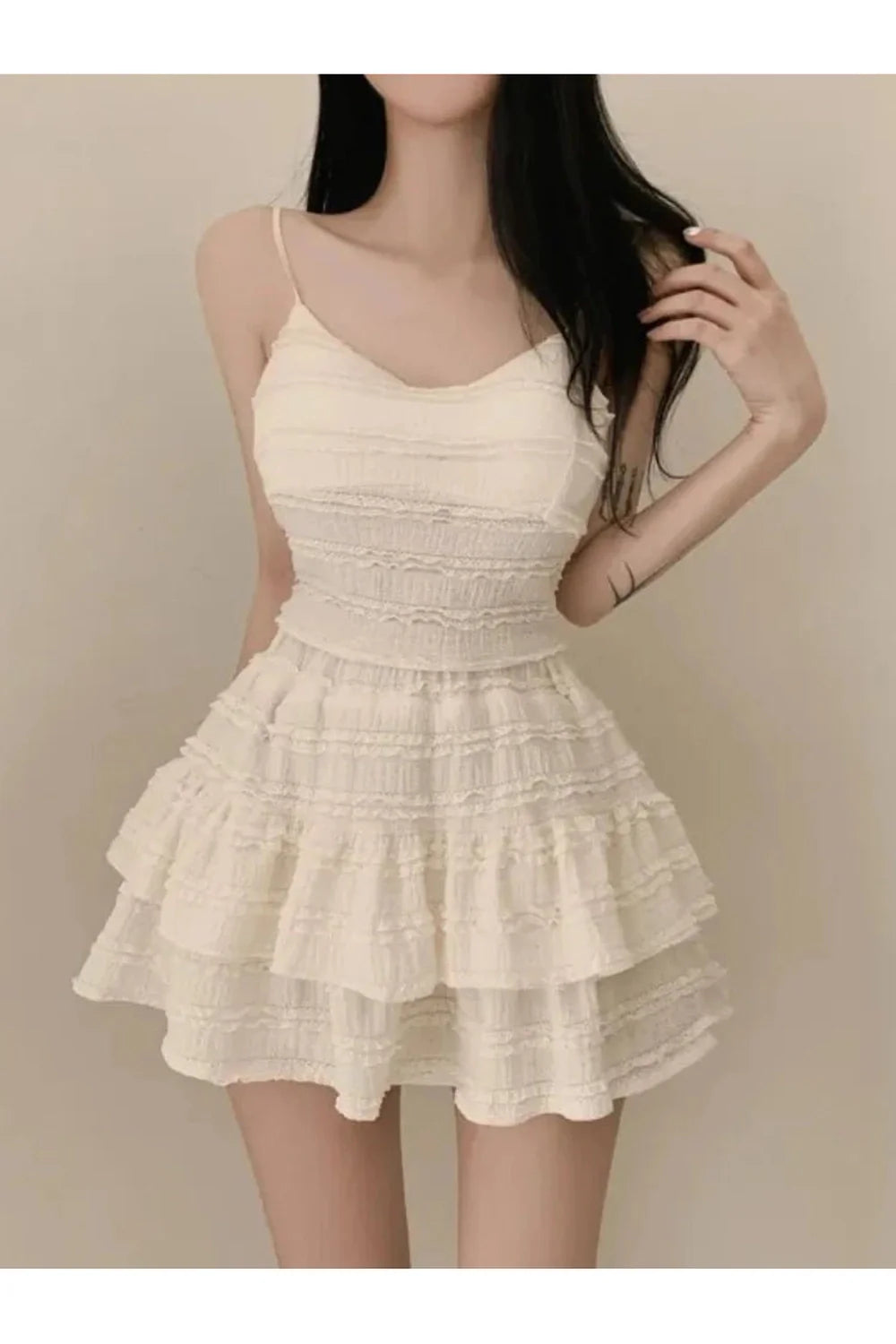 Elegant Beige Ruffled Mini Dress with Strappy Design.