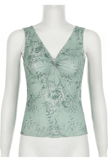 Floral sage green top exudes natural charm.