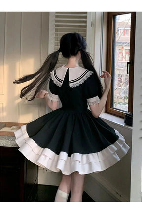 Black Sailor Sweetheart Ruffle Dress with elegance.