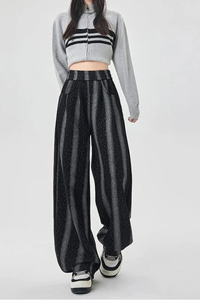 Wide-leg black pants with shadow stripe pattern.