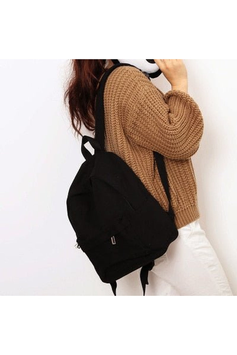 Compact black college backpack with simple design.