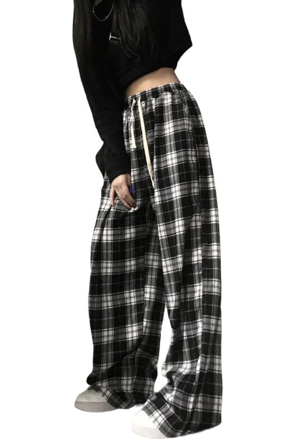 Oversize plaid pants for girls in black color.