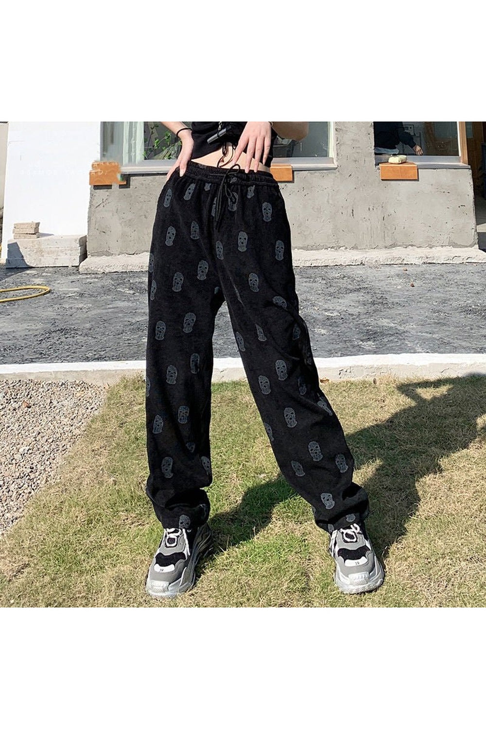 Stylish black Skater Girl Skull Pants feature skulls.