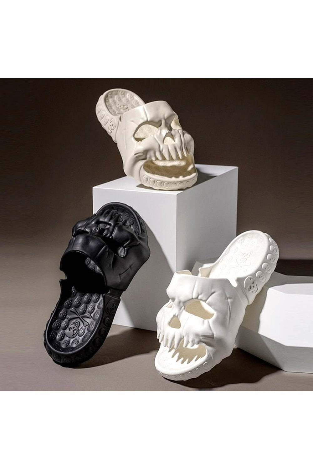 Black skull design slippers with edgy style.