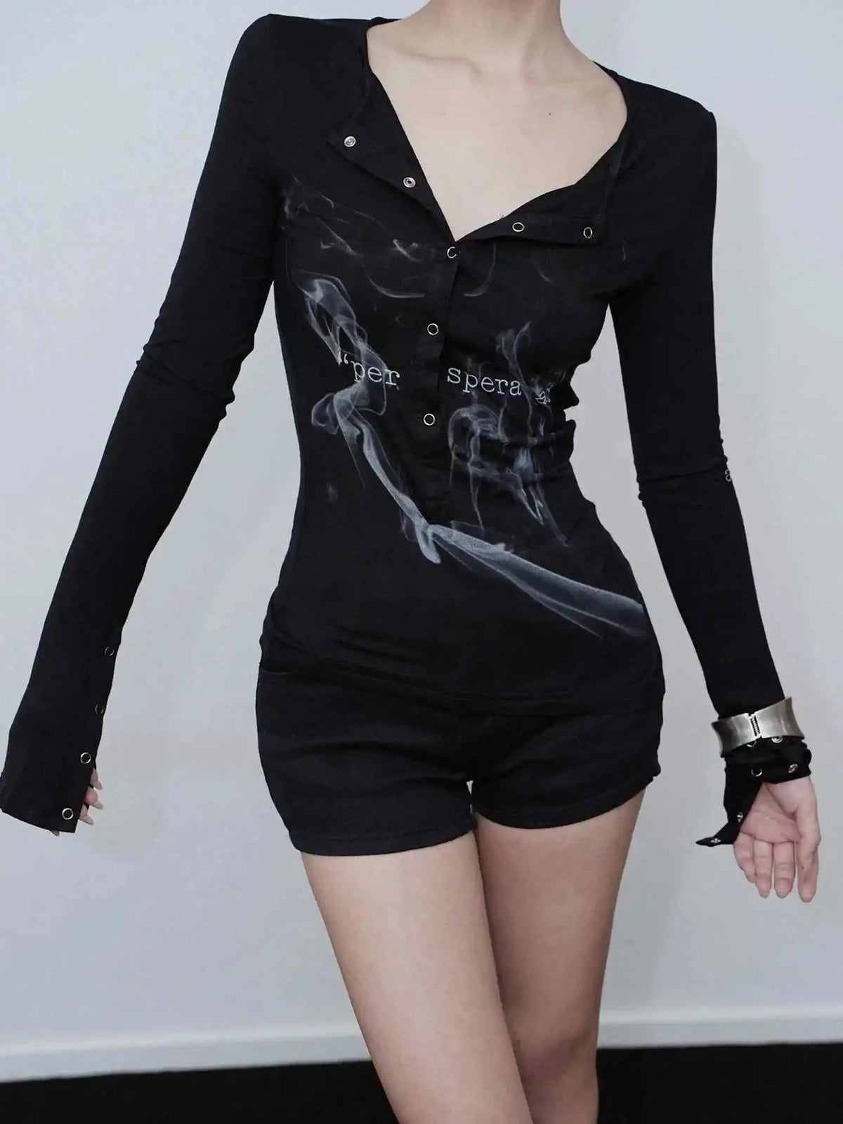 Black smoke print goth top exudes boldness.