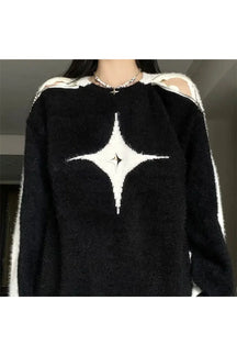 Cozy black distressed knit sweater for fall fashion.