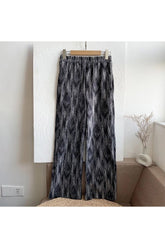 Black tie-dye summer pants for a stylish look.