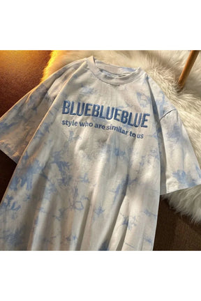 Blue tie-dye T-shirt with embroidery detail.