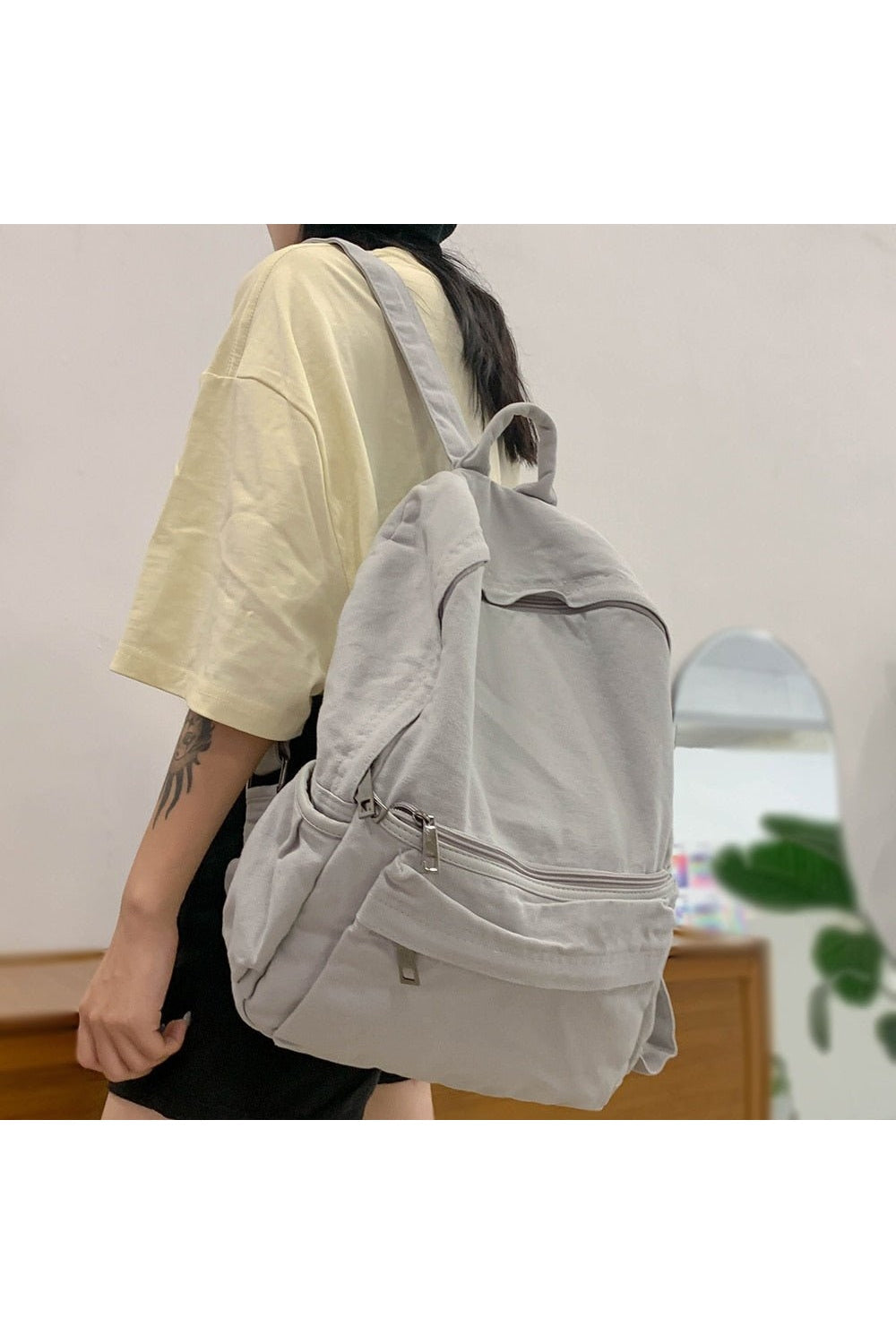 Vintage black canvas laptop backpack for women.