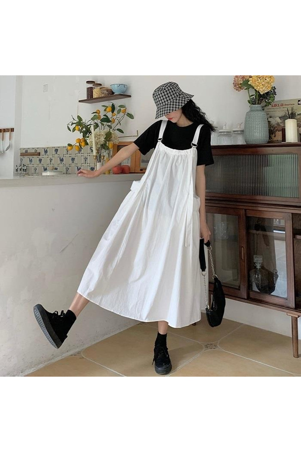 Elegant Vintage Sleeveless Long Dress in white, flowing.