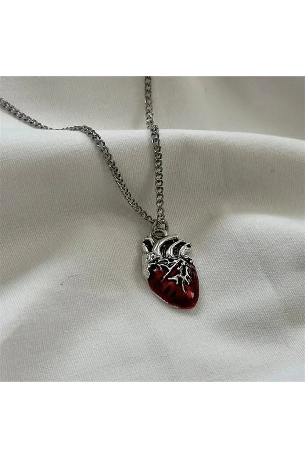 Red Vivid Heartbeat Pendant exudes vibrant energy.