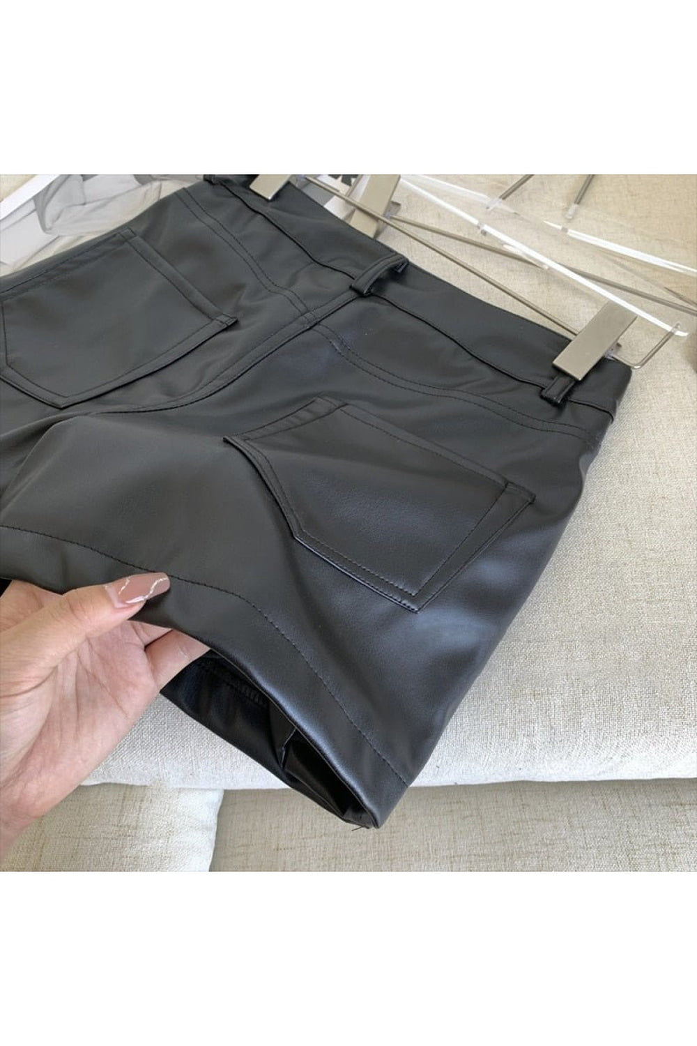 Black1 Y2K style leather mini skirt, sleek design.